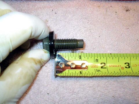 2003 Ford Escape - This leads in to the next pic. It's a 1" long bolt for the oil pan plug. I use a little inward pressure to keep the oil from leaking out wh…