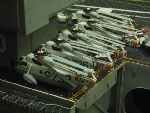 1991 Ford LTD Crown Victoria - diorama of an aircraft carrier deck lined with white Navy helicopters marked NAVY and side numbers including 736 and 739.