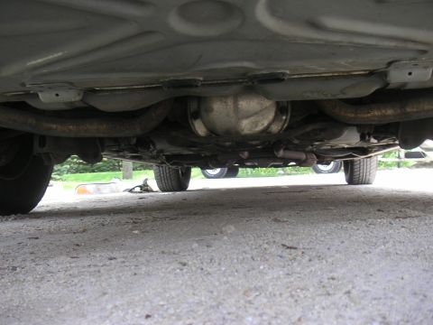1997 Ford Crown Victoria - Underside view of a 1997 Ford Crown Victoria, highlighting its exhaust system and rear differential.