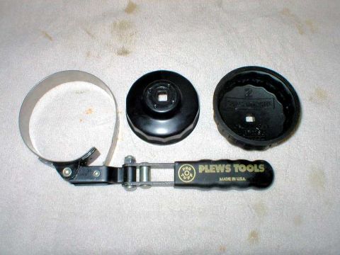 2003 Ford Escape - Here's the filter wrench comparison. As mentioned earlier, I used the "clamp" type, on bottom. A better option would be one of the plastic…