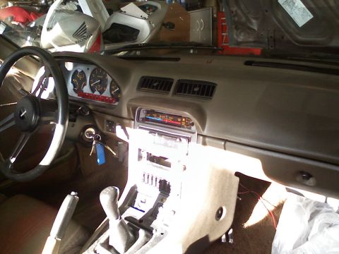 1983 Mazda RX-7 - Interior view of a 1983 Mazda RX-7, focusing on the dashboard and controls.