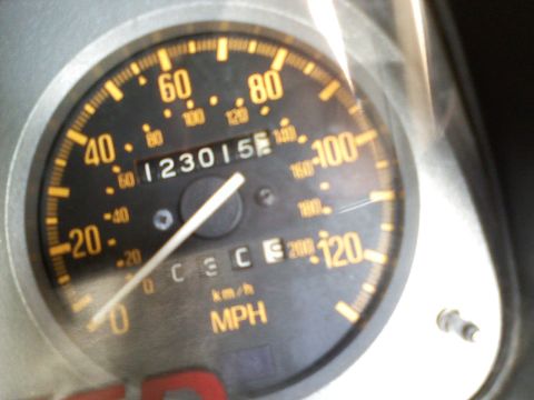 1983 Mazda RX-7 - The odometer shows 123,015 miles, and the tachometer goes up to 8,000 RPM.