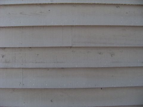 1992 Ford F-150 - The image shows horizontal wooden siding on a building's exterior wall.