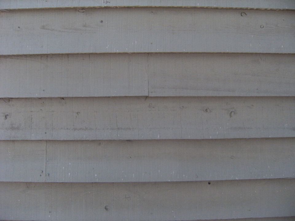 Close-up of gray wooden siding on a building