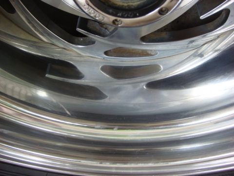 1996 Ford Bronco - Polished chrome wheel and tire detail.