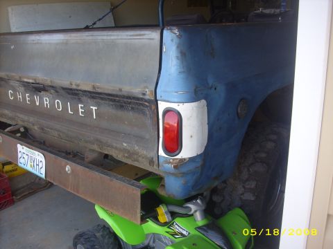 1975 Chevrolet Blazer - Rear view of a 1975 Chevrolet pickup truck, showing the tailgate and fender detail.