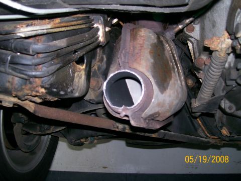 1995 Mercury Grand Marquis - A close-up view of the undercarriage reveals a dual exhaust system and catalytic converter.