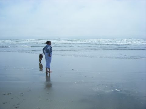 1994 Ford Explorer - Woman and dog on a beach with the ocean in the background.