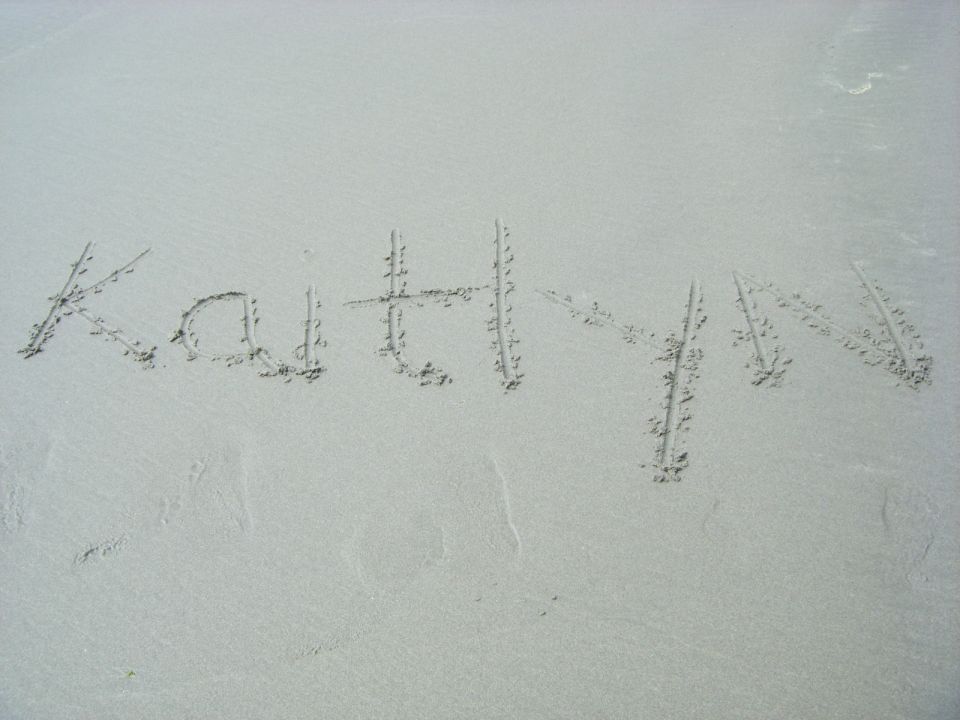 Kaitlyn written in the sand at the beach