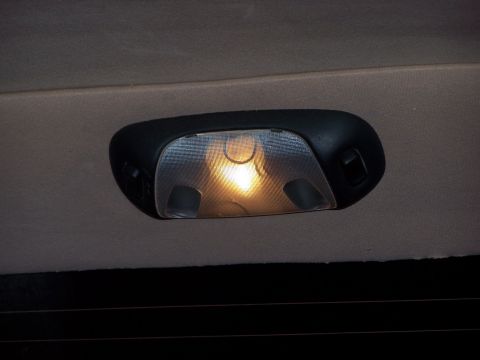1995 Ford C-350 (Centurion Conversions) - Interior dome light assembly with a lit bulb.