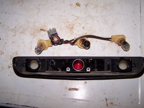 1995 Ford C-350 (Centurion Conversions) - This is a third brake light assembly with its associated bulbs and wiring. The red lens is visible in the center.