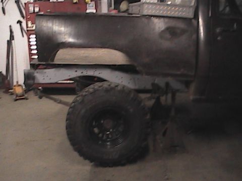 1980 Dodge Magnum - Side view of a truck's rear chassis and bed section, showing suspension and a large tire.