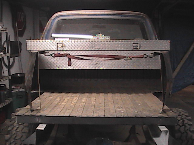 Rear of pickup truck with toolbox and wooden bed