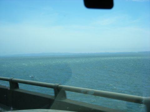 1994 Ford Explorer - Ocean view from a bridge, with hazy land visible on the horizon under a clear blue sky.