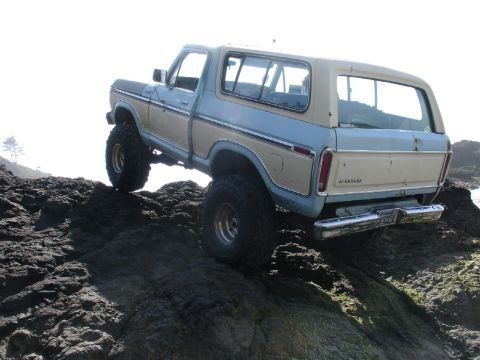 1978 Ford Bronco - This classic Ford Bronco navigates a rocky coastal terrain.