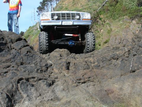 1978 Ford Bronco - Modified 1978 Ford Bronco navigating rocky terrain near the coast.