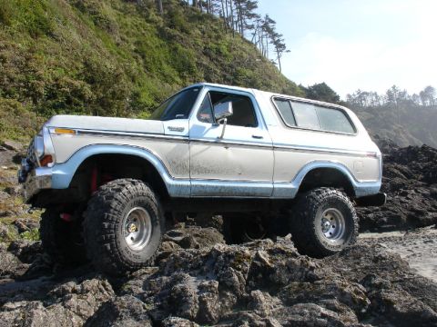 1978 Ford Bronco - This lifted 1978 Ford Bronco navigates a rocky coastal terrain.