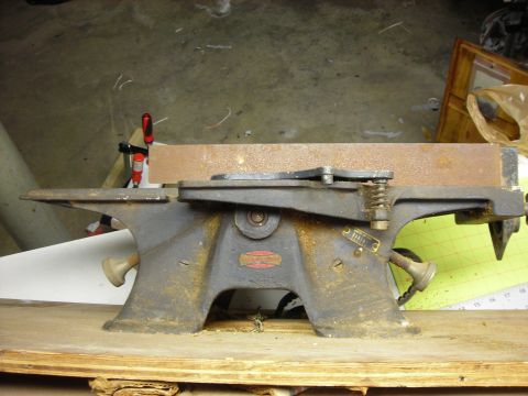 1995 Ford Bronco - This image shows a shop tool, not a 1995 Ford Bronco, with visible rust and a red label on its base.