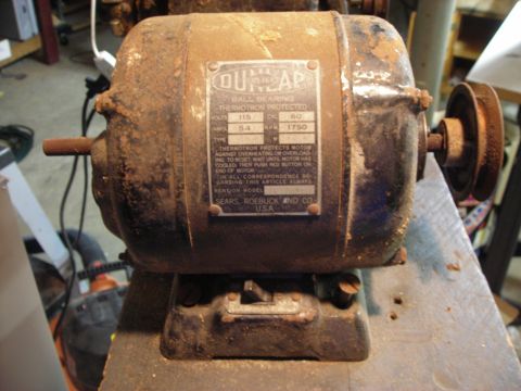 1995 Ford Bronco - A weathered Dunlap motor, likely from Sears, is shown with its identification plate.