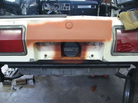 1978 Ford Mustang II - The rear of a car is shown with a new gas tank being installed and the bodywork prepped for paint.
