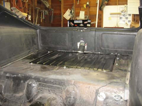 1978 Ford Mustang II - New gas tank installed in the trunk area of a car, with a hose connected to the filler neck.