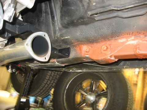 1978 Ford Mustang II - The undercarriage of a 1978 Ford Mustang II is visible, including the exhaust system and wheels.