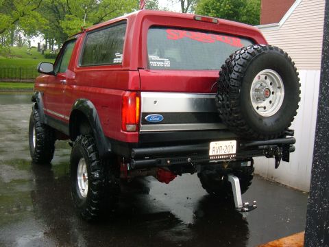 1994 Ford Bronco - This lifted Ford Bronco has a spare tire mounted on the rear bumper, ready for off-road adventures.