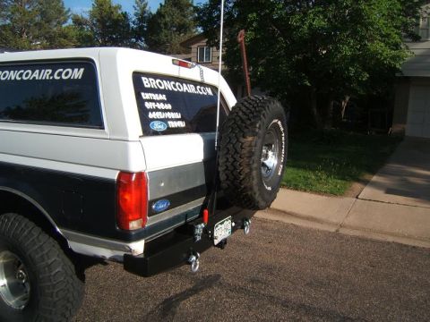 1993 Ford Bronco - Rear view of a 1993 Ford Bronco showing aftermarket bumper and spare tire mount.