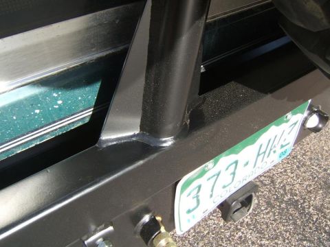1993 Ford Bronco - Close-up of a vehicle's rear bumper, showing a Colorado license plate and part of a spare tire mount.
