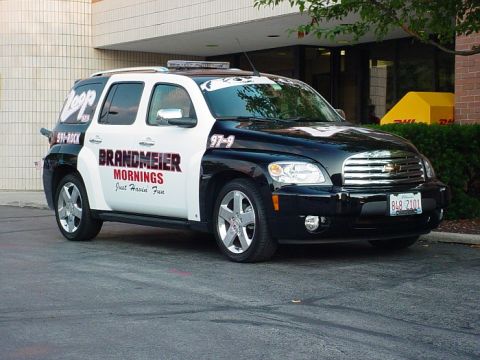 1991 Ford Crown Victoria - This Chevrolet HHR panel van features a two-tone black and white paint scheme with "BRANDMEIER MORNINGS" text on the side.