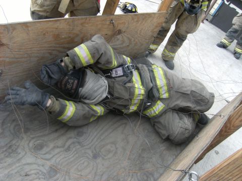 1992 Ford F-150 - A firefighter navigates a simulated obstacle course, demonstrating rescue techniques.