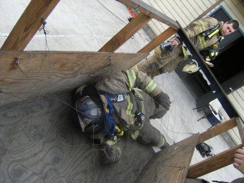 1992 Ford F-150 - Firefighters train in a simulated confined space, practicing movement and rescue techniques.