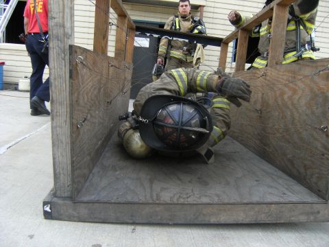 1992 Ford F-150 - Firefighters participate in a training exercise within a confined space structure.