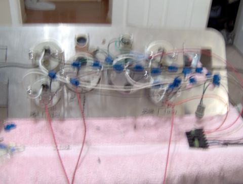 1978 Ford Bronco - A complex wiring harness for a vehicle's dashboard is laid out, ready for installation or repair.