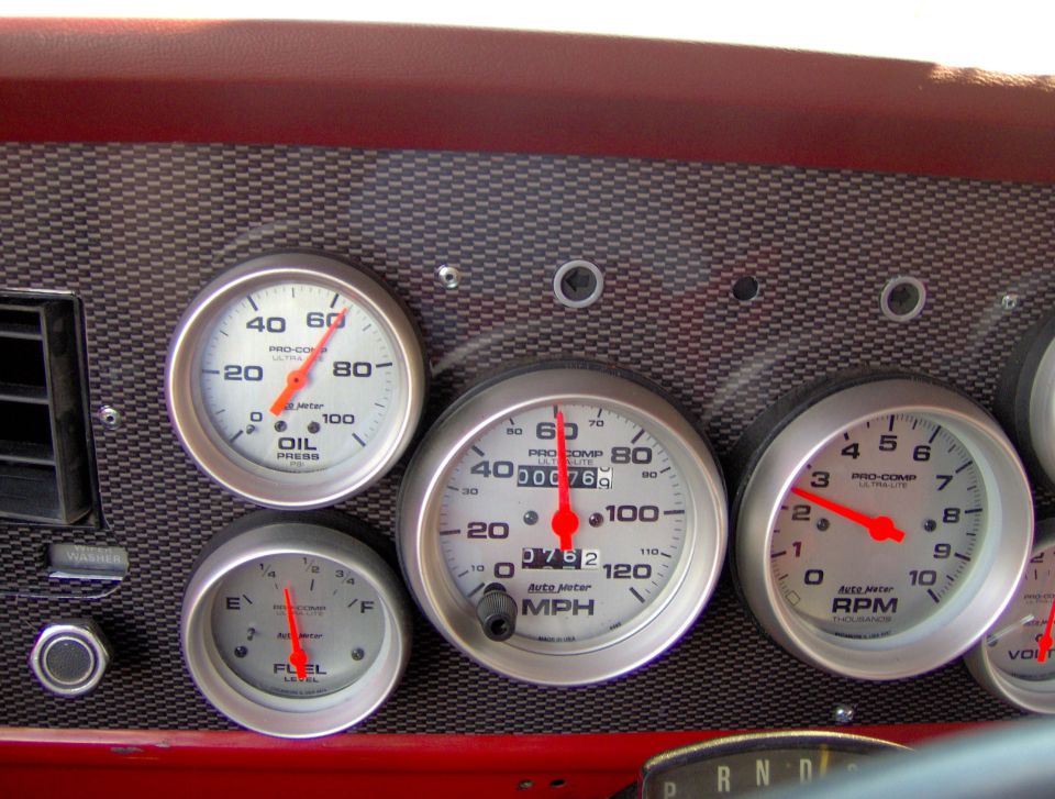 Dashboard with Pro-Comp Ultra-Lite gauges: oil pressure, fuel level, MPH speedometer, and RPM tachometer