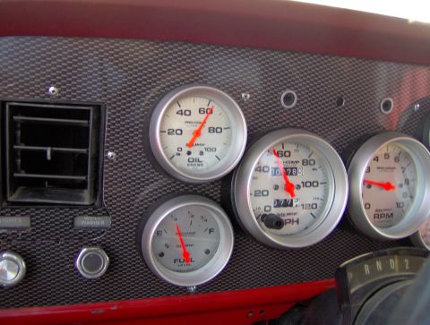 1978 Ford Bronco - Custom dashboard gauges with aftermarket tachometer, speedometer, oil pressure, and fuel level meters.