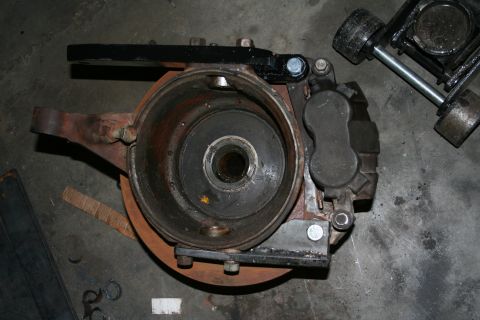 1993 Ford F-350 - Front passenger knuckle with high-steer arm, rotor & caliper. To get the knuckle of the axle you have to pull the axle shafts, which means…