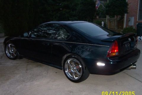 2001 Ford Crown Victoria - This Honda Prelude has aftermarket wheels and a spoiler. The Supermotors.net watermark is visible.