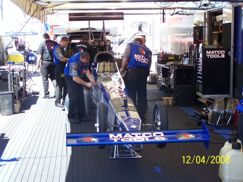 Drag racing car with Matco Tools livery in a pit stop