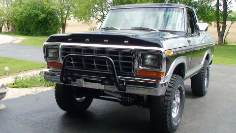 1979 Ford Bronco - This lifted 1978 Ford Bronco features a prominent chrome grille guard and aggressive off-road tires.