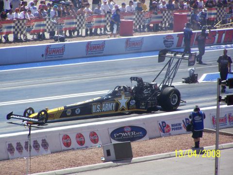 1973 Ford Mustang - A U.S. Army dragster sits on the starting line at a drag racing event.
