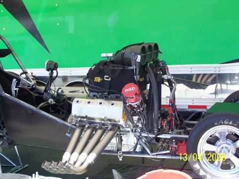 1973 Ford Mustang - Close-up of a high-performance dragster engine, BAE valve covers and MSD ignition components.