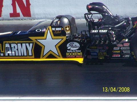 1973 Ford Mustang - A dragster with U.S. Army livery and sponsor decals is seen on the track.