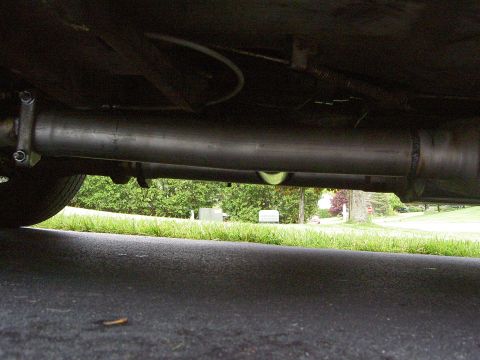 1972 Ford Ranchero - Underside view of a vehicle's exhaust system, showing the pipe and suspension components.