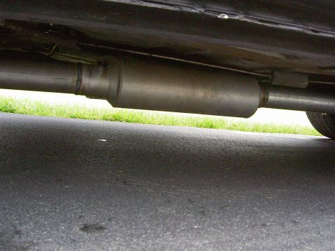 1972 Ford Ranchero - Underside view of a car's exhaust system, showing the muffler and piping.