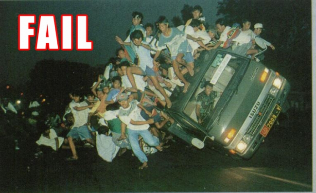 Overloaded car covered in people meme captioned FAIL