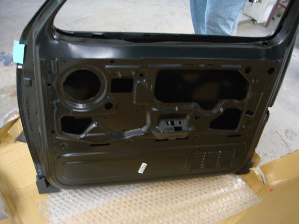 Inner structure of a painted Bronco door shell showing access holes