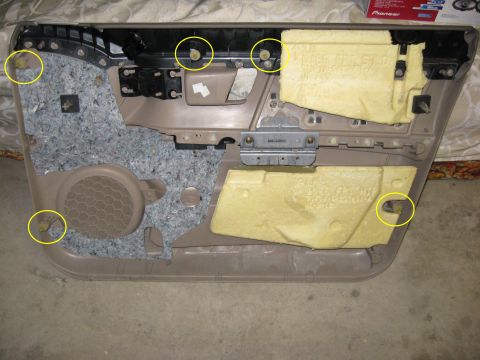 2003 Ford Taurus - The back of the door panel. There are only five retaining pins holding on. There are seven screws around the perimeter that also hold it on…