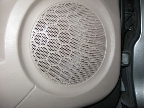 2003 Ford Taurus - The speaker actually sits pretty deep in the door. There has to be a couple inches between the speaker and the grille!