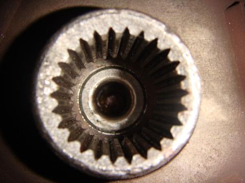 1975 Chevrolet Corvette - A close-up, overhead view of the splined interior of a metal automotive part, likely a hub or coupler. The part has a metallic silver finis…